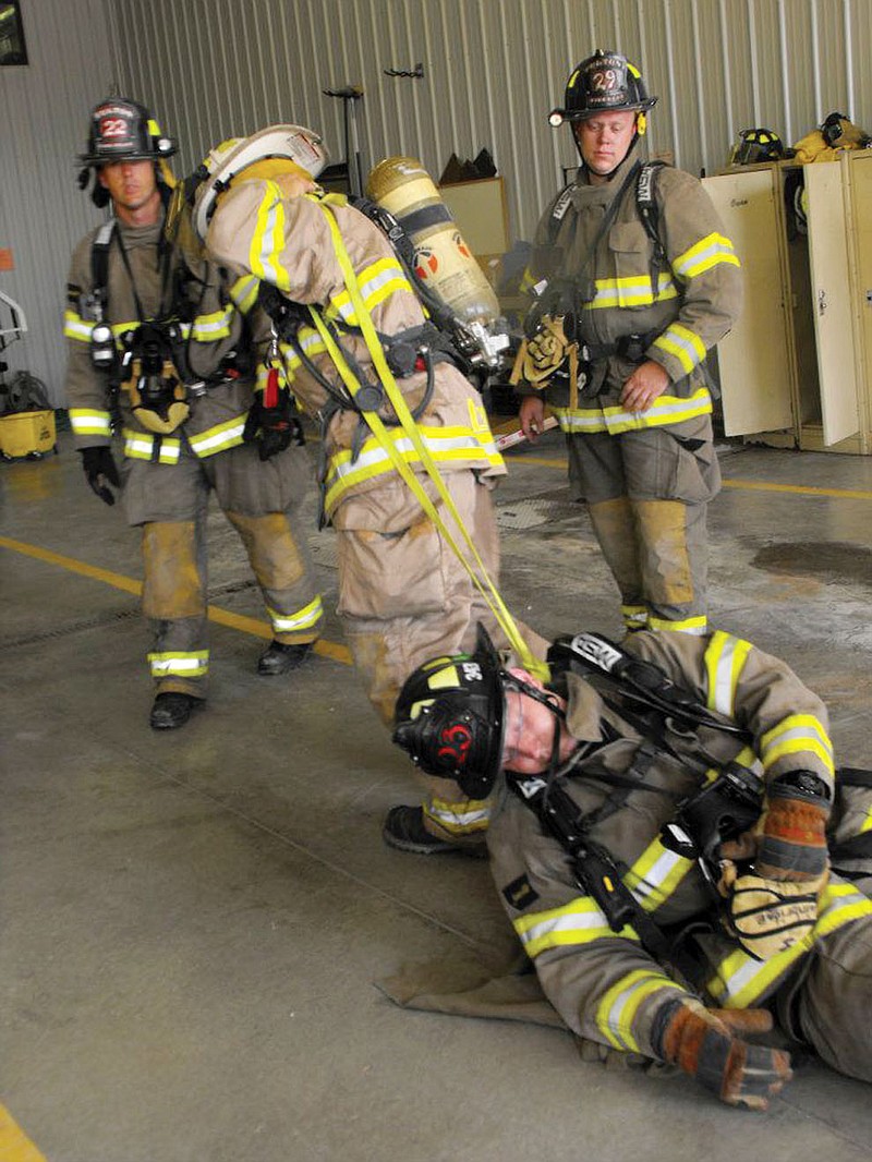 Callaway firefighters practice rescue techniques on their fellow firefighters during RIT training courses. The classes provided firefighters with new, helpful tips on how to best rescue their own from danger.