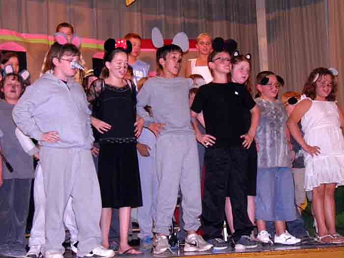 The third and fourth grade dressed as rats perform "Hamelin" during the spring concert.