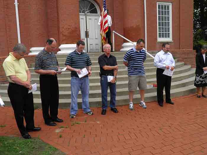 Pastors of the various churches represented get ready to pray over the city, county, state and nation at the observance of the National Day of Prayer held Thursday, May 3, at the Moniteau County Courthouse.