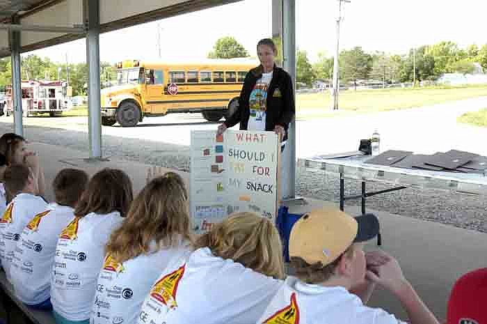 On behalf of Moniteau County Health Services, Christine Koestner reviews healthy choices for the students attending Student Conservation Day.