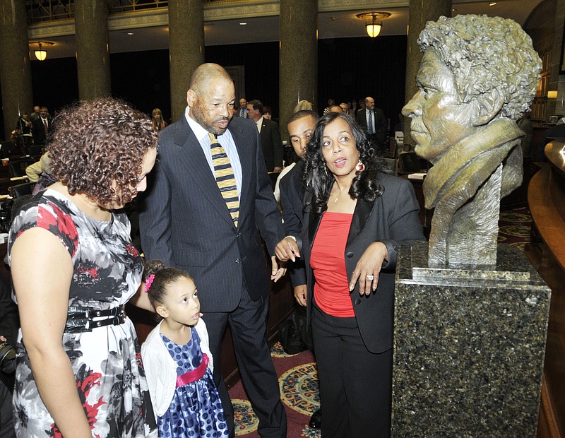 Descendants of Dred Scott were on hand Wednesday, May 9, 2012, in the House of Representatives in the Missouri Capitol for the unveiling of a bust of Scott that will go into the Hall of Famous Missourians. From left, Sarah Madison and daughter, Alyssa, 5, Dred Scott Madison and Lynne Jackson. Jackson is a great-great-grandchild of Scott, as is Dred Scott Madison. Alyssa's dad is great-great-great-grandson, but was unable to make the ceremony.