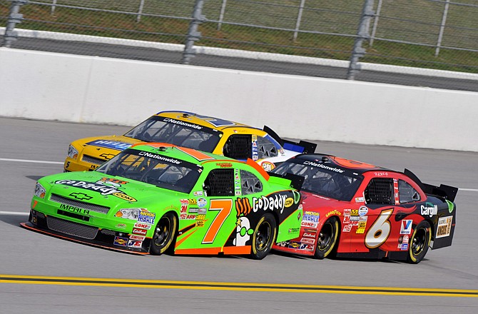 Danica Patrick (7) drives in front of Dale Earnhardt Jr. (5) and Ricky Stenhouse Jr. (6) during Saturday's Aaron's 312 Nationwide race at Talladega Superspeedway in Talladega, Ala. 