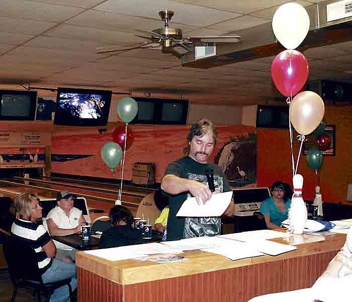 California Lanes owner Rob Rimel presents awards to bowlers for their individual and team achievements for the Wednesday and Thursday night leagues at the annual bowling awards banquet Thursday at California Lanes.