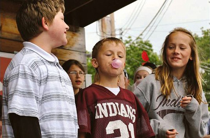 These children enjoyed watching who could blow the largest bubble during the Bubble Gum Blowing Contest at the 2011 Oma Noma Heritage Festival at the Lake of the Ozarks. 