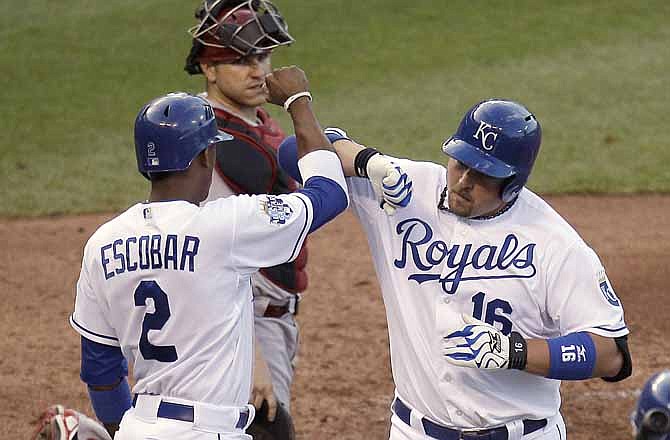 Kansas City Royals' Billy Butler (16) celebrates with Alcides Escobar (2) after Butler hit a two-run home run during the third inning of a baseball game against the Arizona Diamondbacks on Saturday, May 19, 2012, in Kansas City, Mo.