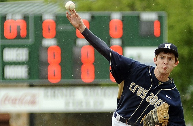 Helias pitcher Blake Monson delivers a pitch during a game earlier this season against Jefferson City.