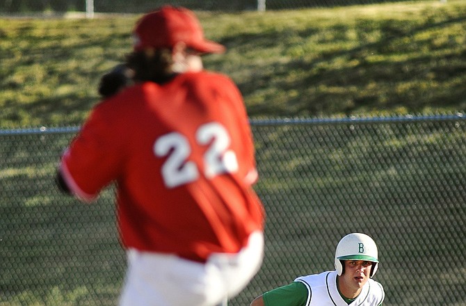 Blair Oaks runner Kyler Maxey takes a short lead from first while keeping a close watch as Mexico starting pitcher Hunter Haynes delivers from the stretch during Tuesday's Class 3 Sectional at the Falcon Athletic Complex in Wardsville.