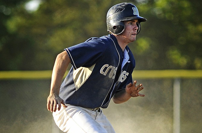Helias outfielder Zach Backes leads off from second base during the Crusaders' 9-3 victory against Rock Bridge in Tuesday's Class 4 Sectional game at the American Legion Sports Complex.