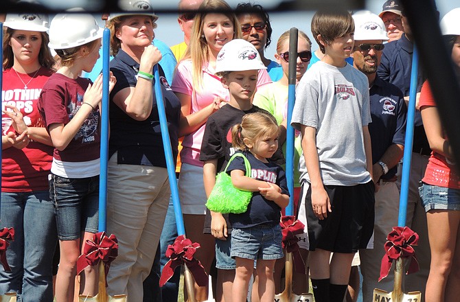 Joplin community members wait to turn ceremonial shovels during the groundbreaking of the new Joplin High School. 