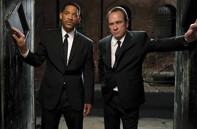 In this film image released by Sony Pictures, Tommy Lee Jones, right, and Will Smith star are shown in a scene from "Men in Black 3." 