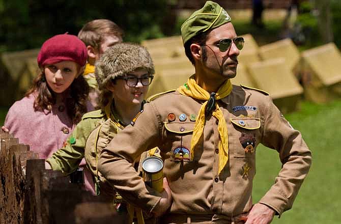 In this film image released by Focus Features, from left, Kara Hayward, Jared Gilman and Jason Schwartzman are shown in a scene from "Moonrise Kingdom."