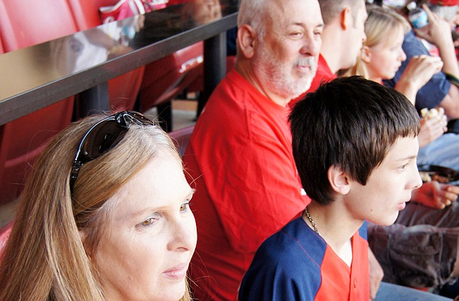 Robert Wendell, along with his wife, Dena, and son, Jon, enjoy watching the St. Louis Cardinals defeat the San Diego Padres on Monday.