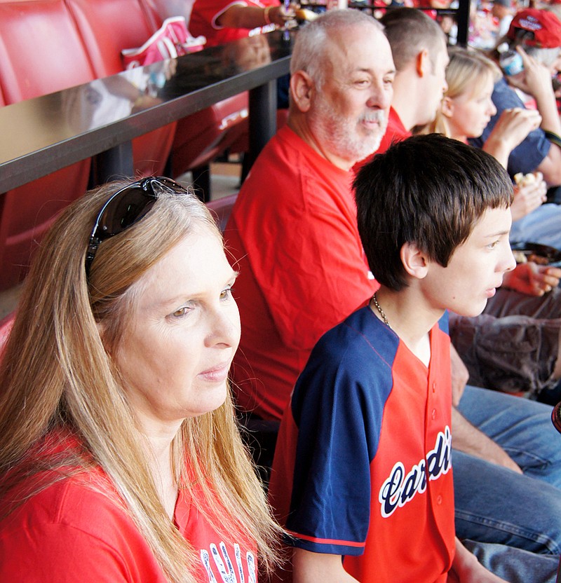 Robert Wendell, along with his wife Dena and son Jon, enjoy watching the St. Louis Cardinals defeat the San Diego Padres Monday. Wendell and his family were treated to the game by Fox Sports Midwest after he returned from a 10-month deployment in Afghanistan with the Missouri National Guard.