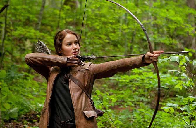 In this image released by Lionsgate, Jennifer Lawrence portrays Katniss Everdeen in a scene from "The Hunger Games." The movie has shined a bright light on the ancient sport of archery and fueled interest across the country to pick up a bow and arrow. 
