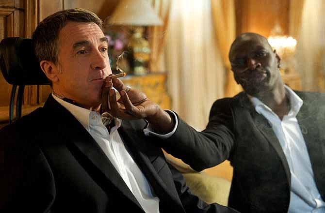 In this film image released by The Weinstein Company, Francois Cluzet, left, and Omar Sy are shown in a scene from "The Intouchables." 