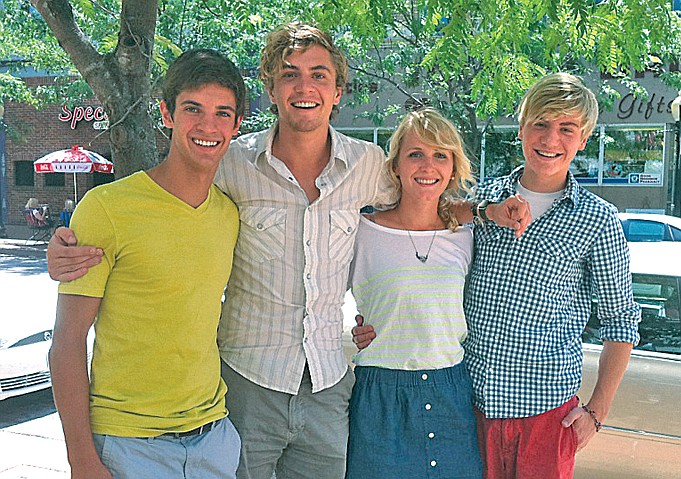 Griffin McCurren, left, stands with his cousins, Forrest McCurren and Quinn McCurren, and their friend, Olivia Wilbers. Forrest, his brother Quinn and their older brother, Mathias, lost their father at a young age. Forrest says he visits the cemetery a few times a year, but also remembers family members at places around town that remind him of them.