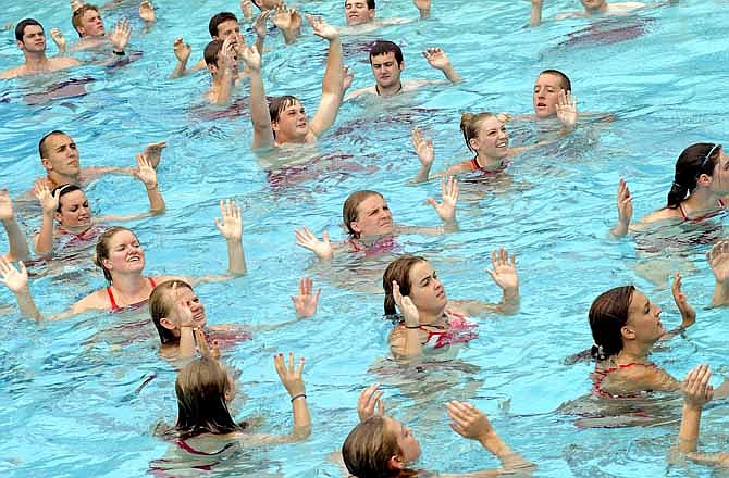 Jefferson City Parks and Recreation lifeguards show their hands while treading water during pre-season training at the Memorial Park Aquatic Center last Thursday. Lifeguards from both the Memorial Park and Ellis Porter pools participated in the training in preparation for opening day on Wednesday.