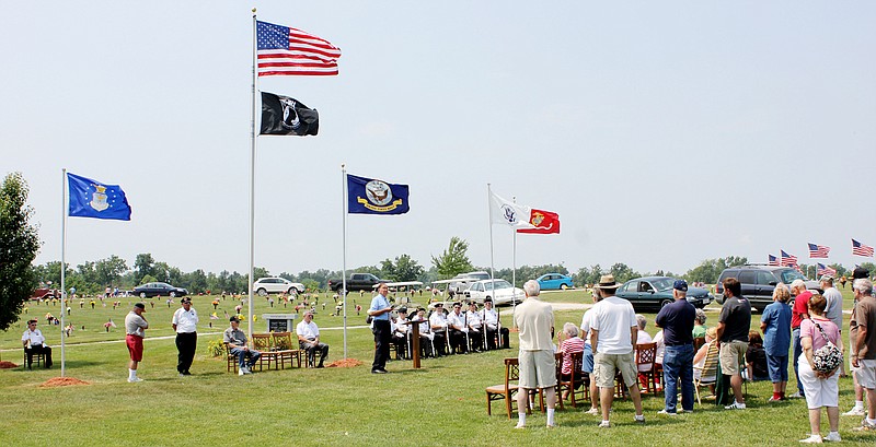 The Rev. Murray Buschert, retired associate pastor of the First Baptist Church of Fulton, speaks to the audience at a Memorial Day observance Saturday at Callaway Memorial Gardens in Fulton.