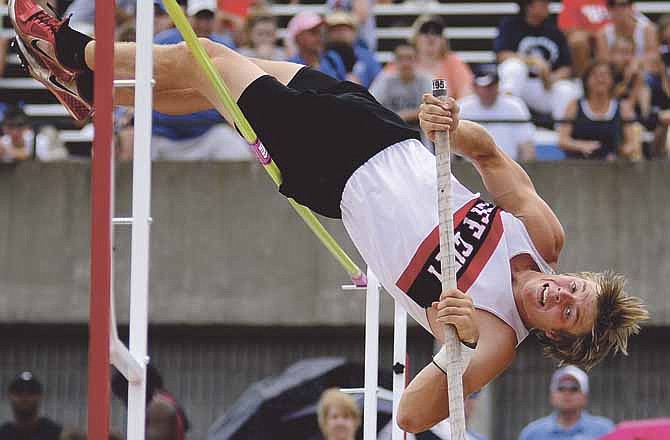 Joey Burkett of Jefferson City clears the bar Saturday during the Class 4 MSHSAA Track and Field Championships at Dwight T. Reed Stadium. Burkett went on to claim the state crown.