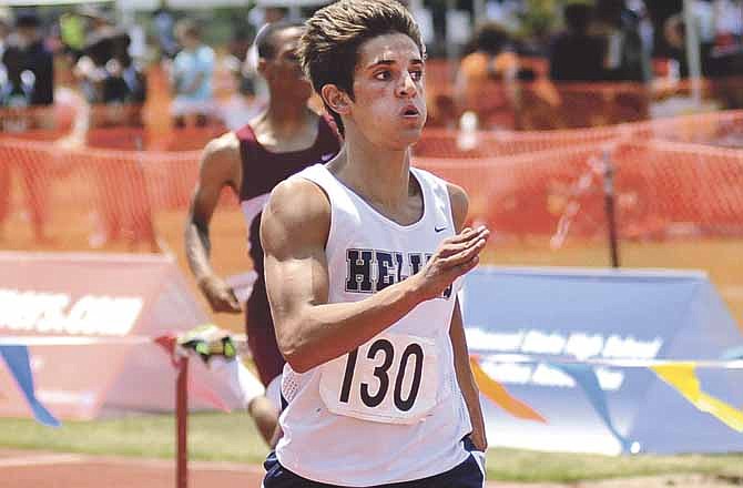 Griffin McCurren of Helias closes in on the finish line in the 400-meter dash Saturday at Dwight T. Reed Stadium.