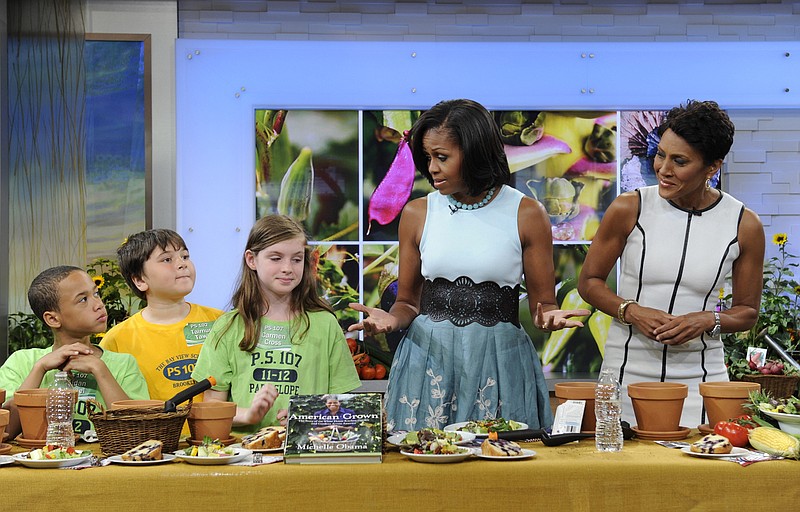 Host Robin Roberts, right, watches as first lady Michelle Obama talks Tuesday with students from PS 102 and 107 from the Brooklyn borough of New York during a segment of "Good Morning America." 