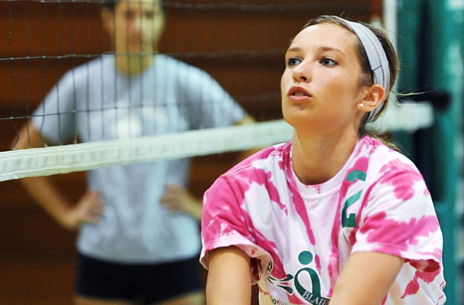 Monica Katnik reaches for the ball to set it up as she and teammates go through drills Wednesday at Blair Oaks volleyball camp.