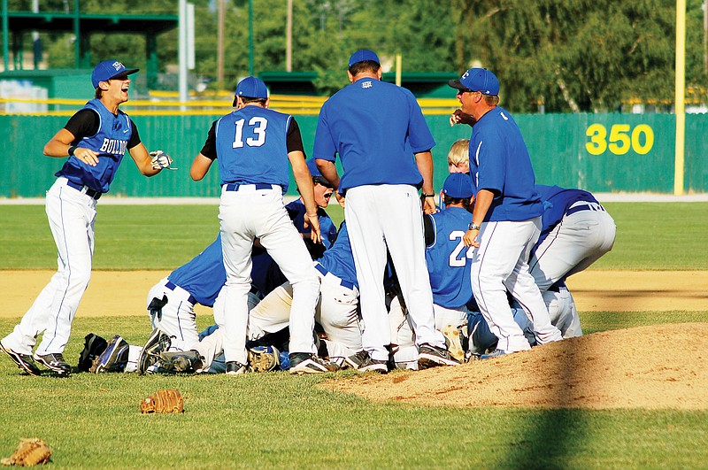 Shelly Sconce/SOUTH CALLAWAY HIGH SCHOOL photo
The South Callaway Bulldogs gather in a pile in the moments after their 4-3 win over Valle Catholic in the Class 2 state championship early Thursday night at Meador Park in Springfield. The Bulldogs' state title is the school's first in any team sport.