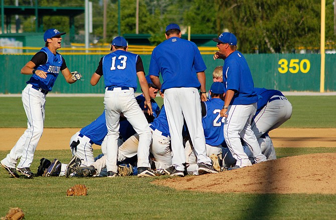 The South Callaway Bulldogs celebrate their Class 2 state baseball championship after a 4-3 victory over Valle Catholic on Thursday at Meador Park in Springfield.