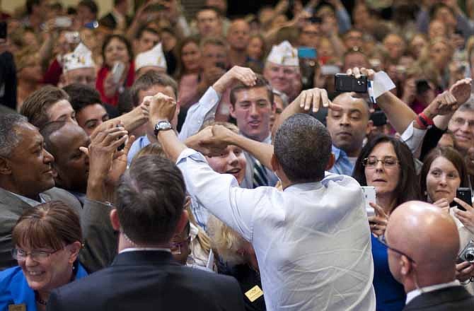 President Barack Obama greets supporters after speaking about jobs for veterans, Friday, June 1, 2012, at Honeywell Automation and Control Solutions Global Headquarters in Golden Valley, Minn.