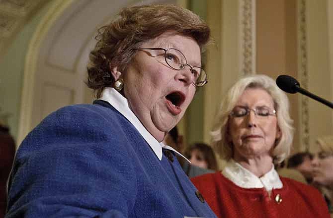 Sen. Barbara Mikulski, D-Md., and Lilly Ledbetter, right, the woman who has been the symbol for the workplace equality movement, speak to reporters at the Capitol as the Senate considers the "Paycheck Fairness Act," in Washington, Tuesday, June 5, 2012.
