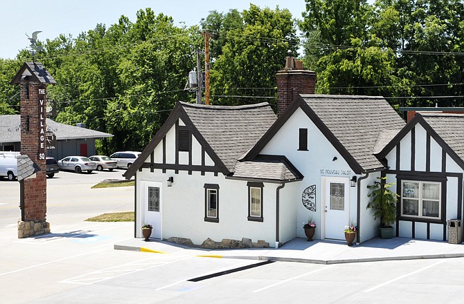 Hank and Linda Stratman are proud of the current state of improvements at the old Warwick Village on the city's east side. From the remodeled property sprang the Brew House and De Nouveau Salon. The salon will celebrate its grand opening Friday afternoon.