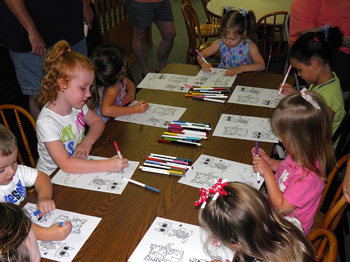 Children had fun coloring in cats with non-permanent markers after hearing the cat-themed story at Wood Place Public Library.