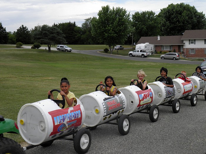 Children have fun riding in the "Barrel Train" during the Annunciation Catholic Church, California, Annual Picnic held Sunday, June 3.