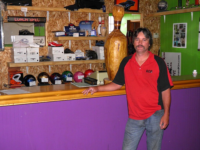 California Lanes owner Rob Rimel in front of the pro shop at the bowling alley which features a full line of bowling balls, accessories and servicing.