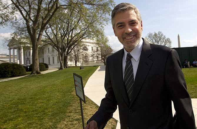 In this March 15, 2012 file photo, actor George Clooney leaves the White House in Washington. If you have $40,000 to spend, President Barack Obama's campaign has a deal for you. Write a big check, and you'll get you a picture with the president and the chance to swap political strategy him _ all while enjoying a gourmet meal at the lavish home of a Hollywood celebrity or Wall Street tycoon. 