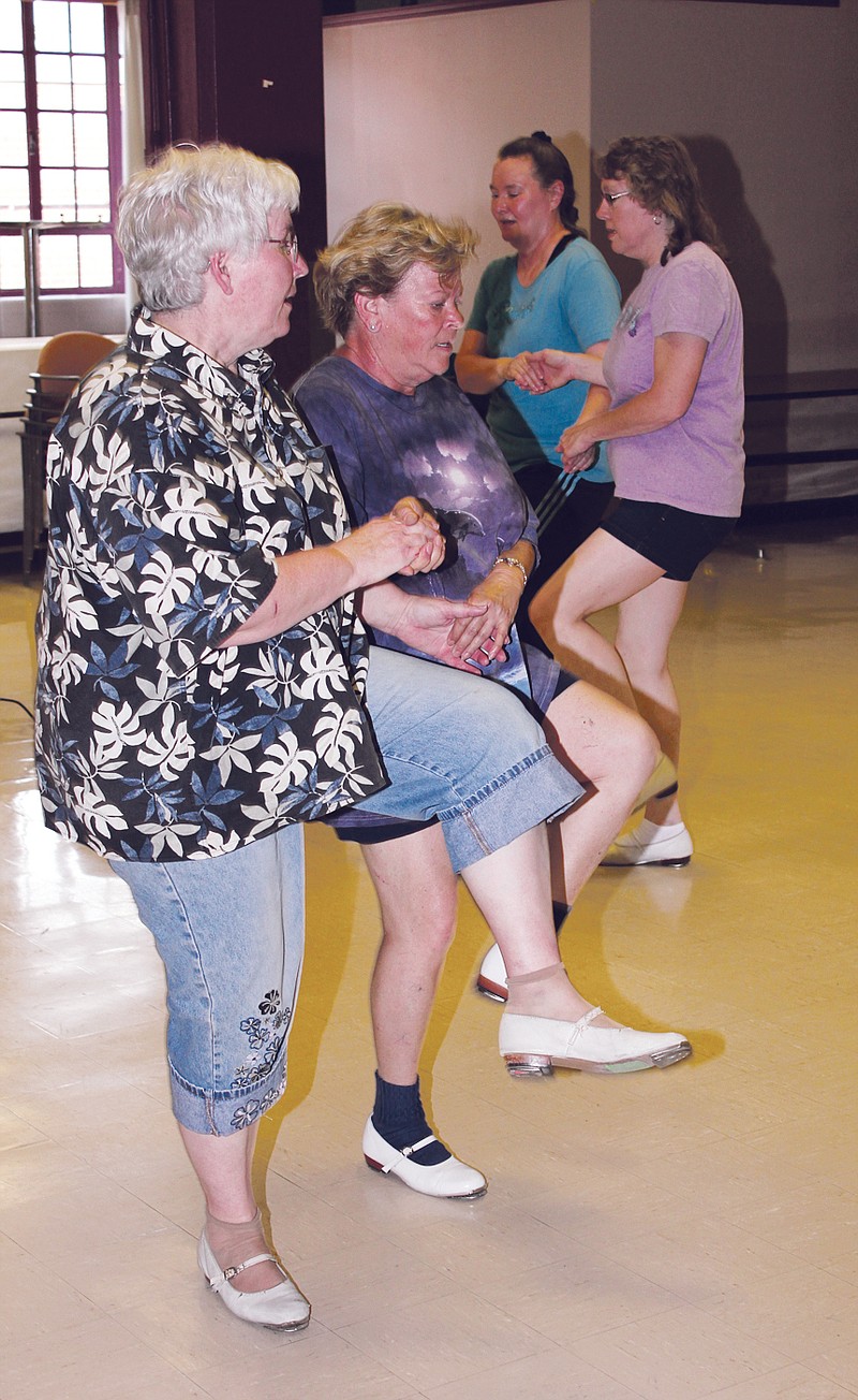 The Mule Kickers practice their clogging routine Wednesday evening in the Plum Room at Fulton State Hospital. The group will perform at the Fulton Street Fair 4 p.m. June 16.