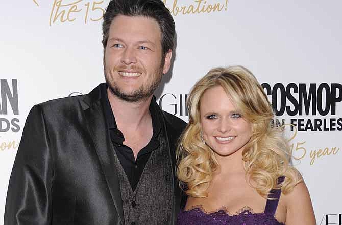 This March 5, 2012 file photo shows country singers Blake Shelton, left, and his wife, Miranda Lambert at Cosmopolitan Magazine's "Fun Fearless Males and Females of 2012" awards in New York. The couple is attending CMA Music Fest this week, a four-day opportunity to interact with fans.