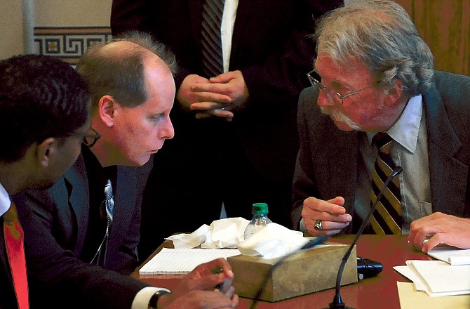 Defense attorney Jan King, right, talks with defendant Keith Kellner during Kellner's trial Monday at the Cole County Courthouse.
