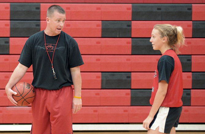 Lindsey Greene listens to Jefferson City girls basketball coach Shane Meyer during the team's camp Wednesday at Fleming Fieldhouse.