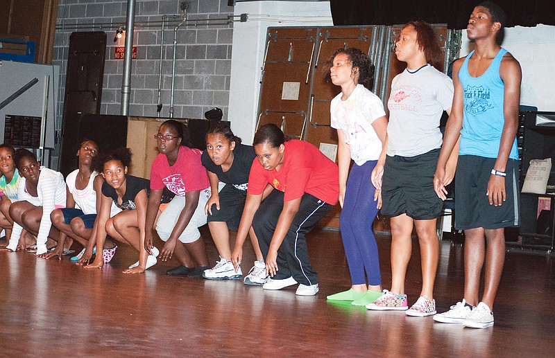 Members of the Footprints Project Dance Team practice their "In The Hood" routine Thursday for the Juneteenth celebration on Saturday. They will be dancing a combination of modern, gospel, tap, jazz and African dance.