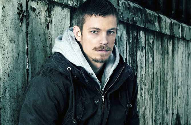 This undated publicity image released by AMC shows Joel Kinnaman, who portrays Seattle Police detective Stephen Holder in the series "The Killing."