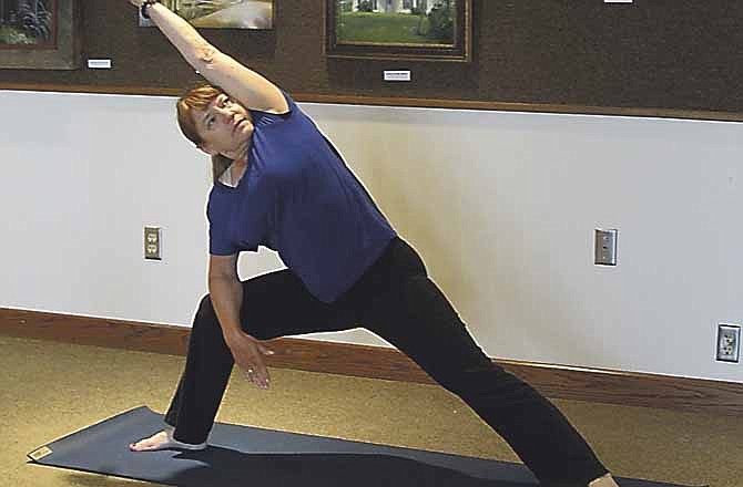 Alberta Mobley leads a yoga class at Missouri River Regional Library in Jefferson City.