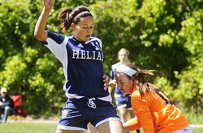 Helias forward Alexis Melcher taps a misplayed ball toward the goal during a game last season. Melcher will take part in the fifth-annual Central Missouri All-Star Soccer game today in Ashland.