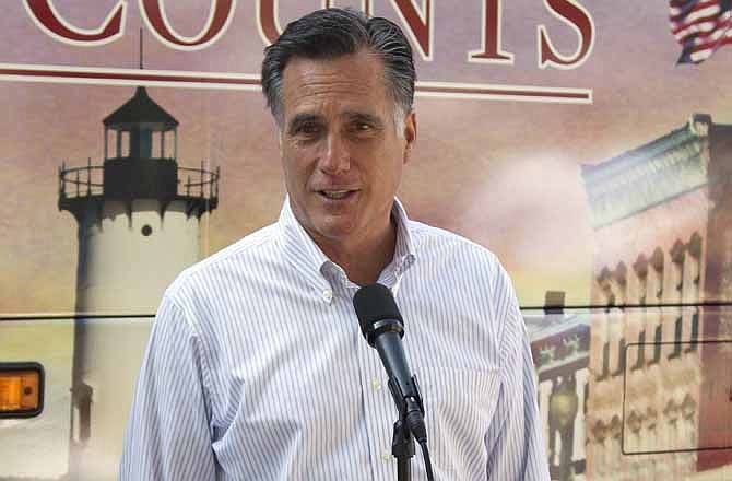 In this June 19, 2012, file photo, Republican presidential candidate, former Massachusetts Gov. Mitt Romney speaks in Holland, Mich. A new Associated Press-GfK poll shows that Republican challenger Romney has moved into a virtually even position with the president after three months of declining job creation that have left the public increasingly glum.
