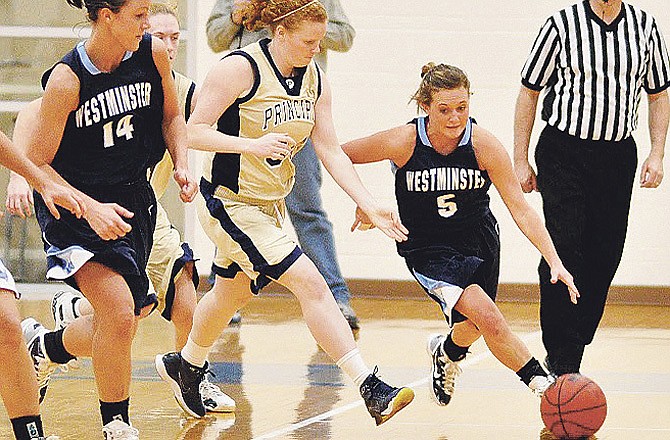 In this file photo from February 2011, Westminster College guard Rachel Backes dribbles around a Principia College defender during a Lady Blue Jays' victory at Elsah, Ill. (David Klaffenbach/Contributed photo)