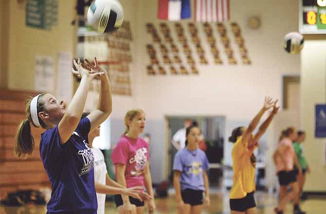 Lanie Berhorst, who'll be in eighth grade this fall, works on her setting skills during Thursday's volleyball camp at Blair Oaks. 