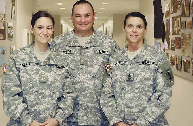 Michelle Smith, left, continues service to the National Guard, in the footsteps of her parents, Willie and Jeanne Smith. All three work for the Missouri National Guard. 