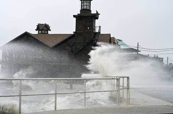 High winds, high tide strike at the main street of Cedar Key, Fla., as Tropical Storm Debby makes its way across the Gulf of Mexico early Sunday.