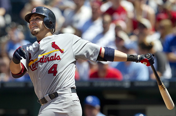 The Cardinals' Yadier Molina hits a solo home run during the sixth inning against the Royals on Sunday at Kauffman Stadium in Kansas City. The Cardinals won 11-8.