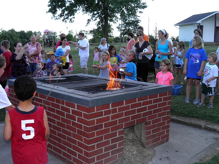 After storytime, Library Director Connie Walker helped the children roast marshmallows and make s'mores.
